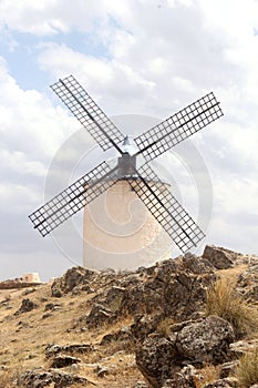 Ancient Spanish mill of Consuegra on the rocks in Castilla La Mancha, Spain photo