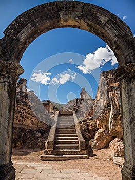 Ancient staircase behind arch