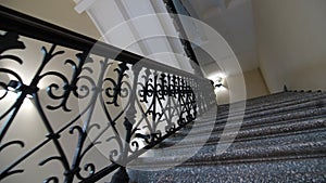 Ancient stairs with forged railing and ornate in theater