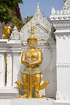 Ancient statue of the evil demon guarding the passage to the Buddha sculpture. Bangkok