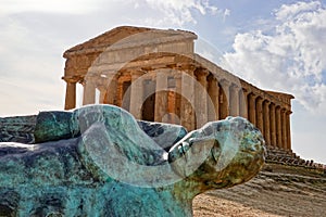 Ancient Statue of the Fallen Icarus in the front of the Tempio della Concordia in Valley of the Temples near Agrigento, Sicily