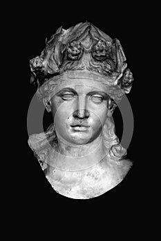 Ancient statue of god of wine, fun and entertainment Bacchus Dionysus against black background. Black and white vertical image