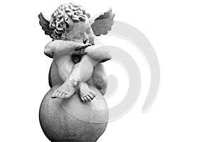 Ancient statue of little guardian angel . Faith, hope, religion, Christianity, good concept. Black and white image