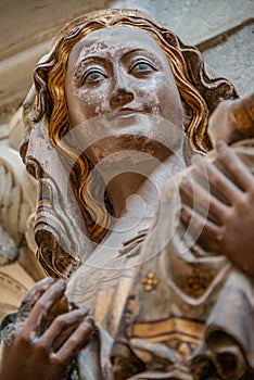 Ancient statue of Maria and Chris as baby at her hands, Magdeburg, Germany, details, closeup