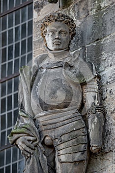 Ancient statue portrait of Saint Maurice black Knight as gatekeeper in Magdeburg Cathedral as Roman soldier from Thebes of 13