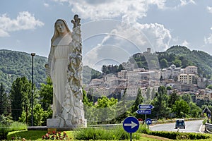 The statue of Santa Rita da Cascia welcomes the faithful at the entrance of the town, Cascia, Italy photo