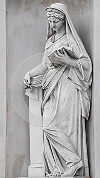 Ancient statue of sensual Italian Renaissance Era woman reading a book, Potsdam, Germany, details, closeup