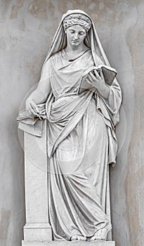 Ancient statue of sensual Italian Renaissance Era woman reading a book, Potsdam, Germany, details, closeup