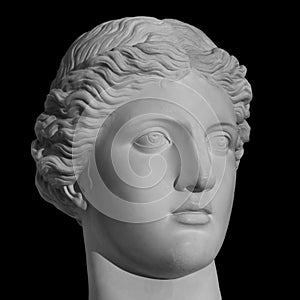 Ancient statue Venus head isolated on black background. Plaster antique sculpture of young woman face. Gypsum head