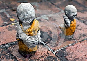 Ancient statuette at the buddhists temple in Ayuttaya, Thailand