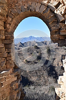 Stone archway at the Great Wall in Jinshanling in winter near Beijing in China