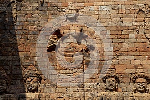 Ancient stone bas-relief of Kravan temple, Angkor Wat, Cambodia. Ancient temple decor - devata woman figure