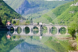 Ancient stone bridge on drina river photo