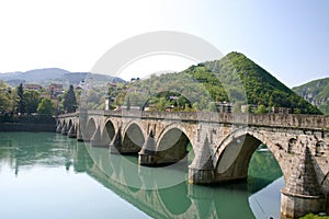 Ancient stone bridge on drina river photo