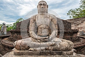 The ancient stone Buddha on the upper platform in the Vatadage, ancient city of Polonnaruwa.