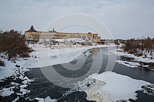 Ancient stone castle in winter. Landscape.