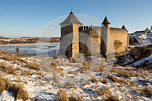 Ancient stone castle in winter. Landscape.