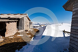 Ancient Stone Cow Shed on Lessinia Plateau in Winter with Snow - Veneto Italy