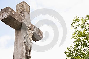 Ancient stone cross on the background of the sky religion, Christianity, faith concept