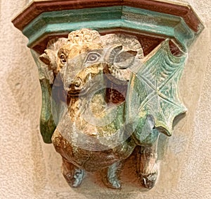 Ancient stone demon sculpture. Gothic church decoration