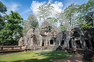 Ancient stone door with clear blue sky, Ta Prohm temple ruins, A