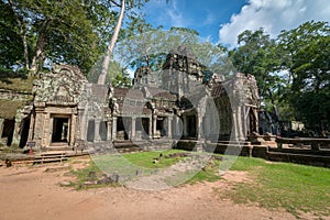 Ancient stone door with clear blue sky, Ta Prohm temple ruins, A