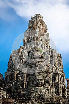 Ancient stone faces Bayon temple in Angkor Thom