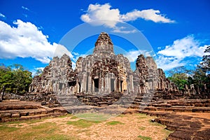 Ancient stone faces of Bayon temple, Angkor Wat, Siam Reap.