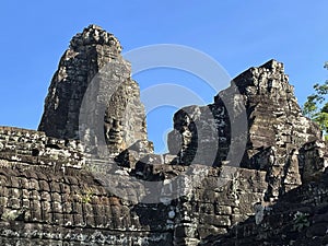 Ancient Stone Faces: Bayon Temple Enigmatic Carvings Figures, Angkor Wat, Siem Reap, Cambodia