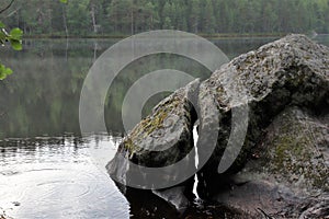 An ancient stone with a fracture in the nature photo