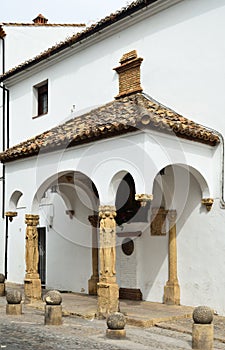 The ancient stone house with a portico