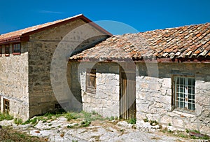 Ancient stone house tile roof