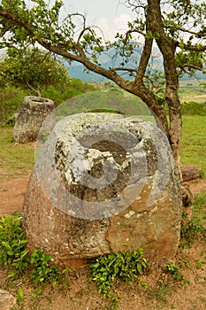 Ancient stone jars in a Plain of Jars Site #2 near Phonsavan,  Xienghouang province, Laos.