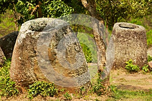 Ancient stone jars in a Plain of Jars Site #2 near Phonsavan,  Xienghouang province, Laos.