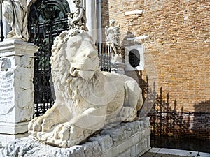 Ancient stone lion statue at the gates of Arsenal, Venice