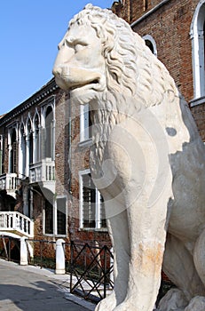 Ancient stone lion statue at the gates of Arsenal, Venice, Italy