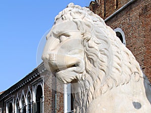 Ancient stone lion statue at the gates of Arsenal, Venice, Italy