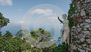 Ancient stone mane sculpture on Monte Solare gaze over Sorrento Peninsula