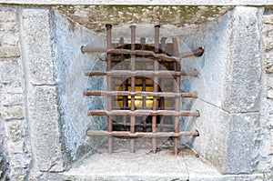 Prison wall with metal window bars