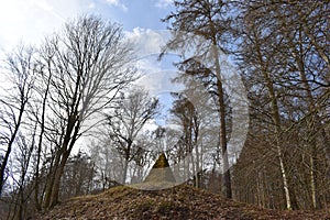 Ancient stone pyramid with moss in the forest on the way to the World Cultural Heritage Herkules in Kassel, WilhelmshÃ¶he, Germany