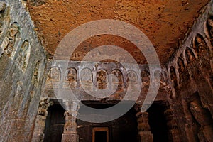 Ancient stone relief in Ajanta caves, India. The Ajanta Caves in Maharashtra state are Buddhist caves