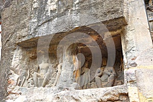 Ancient stone relief in Ajanta caves, India. The Ajanta Caves in Maharashtra state are Buddhist caves