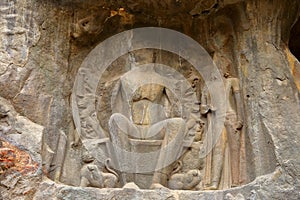 Ancient stone relief in Ajanta caves, India. The Ajanta Caves in Maharashtra state are Buddhist caves