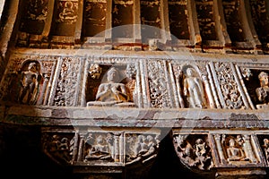 Ancient stone relief in Ajanta caves, India. The Ajanta Caves in Maharashtra state are Buddhist caves