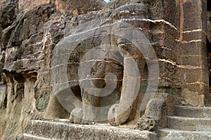 Ancient stone relief in Ajanta caves, India. The Ajanta Caves in Maharashtra state are Buddhist caves