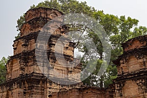 Ancient stone ruin of Kravan temple, Angkor Wat, Cambodia. Ancient temple tower in forest.