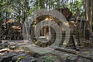 Ancient stone ruin of Preah Monti temple, Roluos, Cambodia. Stone carved decor on hindu temple. Cambodian landscape