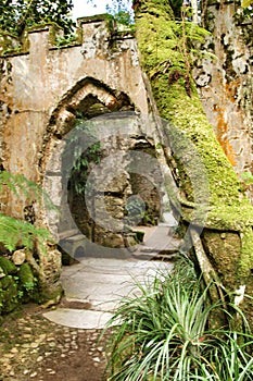 Ancient stone ruins in a leafy garden of Sintra