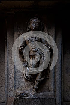 Ancient stone sculpture on the wall of Bhuleshwar temple at Yavat Maharashtra, India.