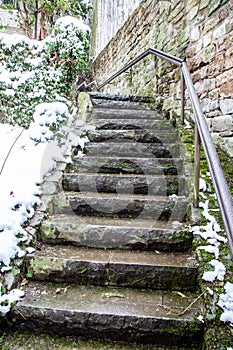 Ancient stone stairs covered with snow